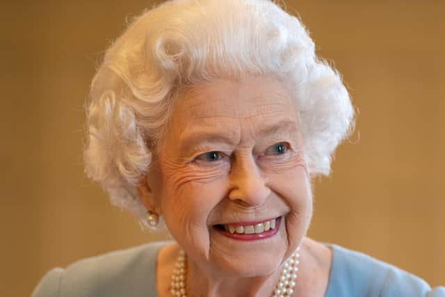 File photo dated 05/02/22 of Queen Elizabeth II who has cancelled her planned virtual engagements after continuing to suffer from mild cold-like symptoms due to Covid, Buckingham Palace has announced. The monarch, 95, tested positive for the virus on Sunday, and had virtual audiences planned for Tuesday. Issue date: Tuesday February 22, 2022.