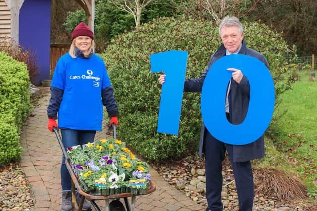 Celebrating 10 years of Cares Challenge are NI Water chief executive, Sara Venning and Kieran Harkin, managing director of Business in the Community