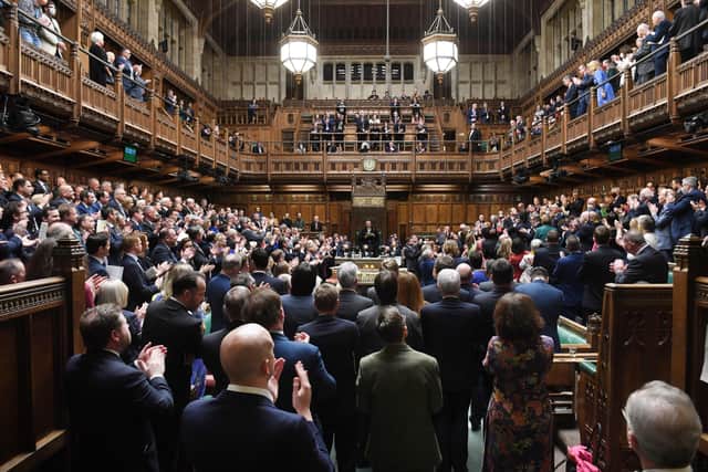 MPs give a standing ovation to Ambassador of Ukraine to the UK Vadym Prystaiko who was in the public gallery, above right.  Sammy Wilson says: "It was one of the most emotional moments I have experienced in my 17 years in Parliament" Photo: UK Parliament/Jessica Taylor/PA Wire