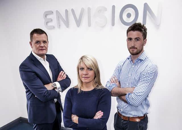Envision Intelligent Solutions’ founder Philip Murdock with Amanda Campbell and Graeme McCandless from the firm’s senior management team