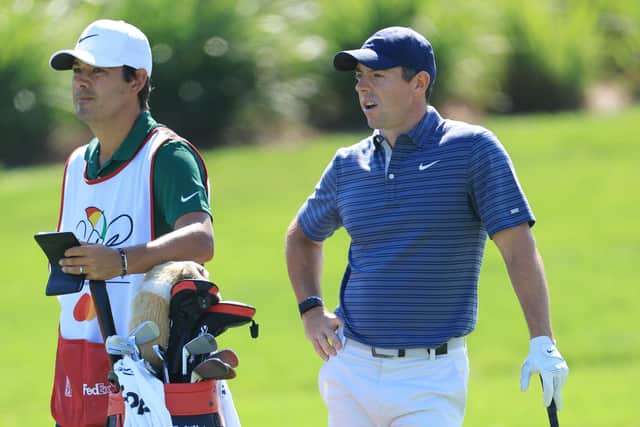 ORLANDO, FLORIDA - MARCH 03: Rory McIlroy of Northern Ireland talks with his caddie Harry Diamond on the 18th hole during the first round of the Arnold Palmer Invitational presented by Mastercard at Arnold Palmer Bay Hill Golf Course on March 03, 2022 in Orlando, Florida. (Photo by Sam Greenwood/Getty Images)