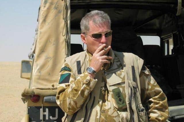 A cigar chomping Colonel Tim Collins seen in Iraq in 2003, when he commanded the Royal Irish Regiment