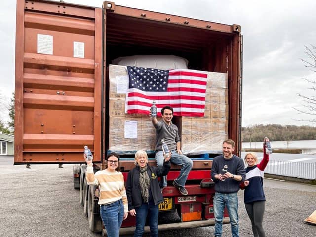 Entrepreneur Joe McGirr and his team with the company’s first container loaded with of innovative double distilled gin set for the best bars in New York