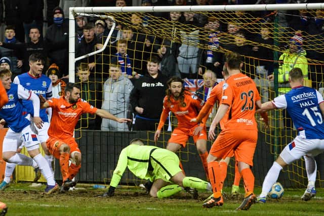 Chris McKee (left) helped Linfield secure three vital points over Carrick Rangers. Pic by Pacemaker.