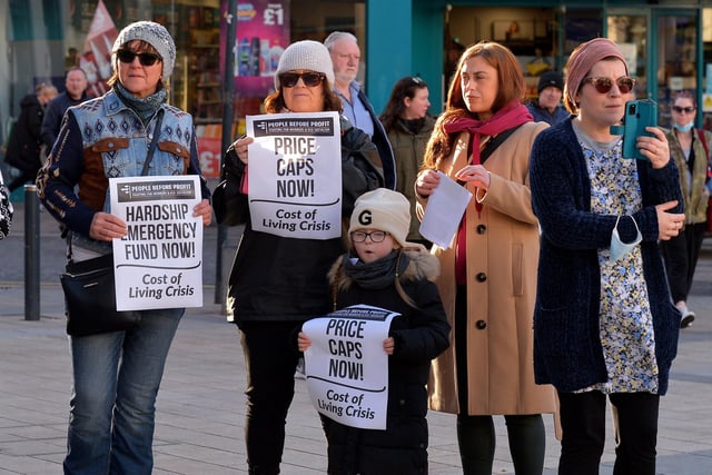 People carry placards at the Derry Against Fuel Poverty protest in Waterloo Square on Saturday afternoon last. Photo: George Sweeney.  DER2209GS – 057