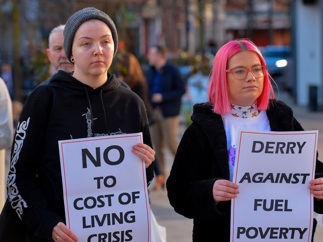 People carry placards at the Derry Against Fuel Poverty rally in Waterloo Square on Saturday afternoon last. Photo: George Sweeney.  DER2209GS – 066