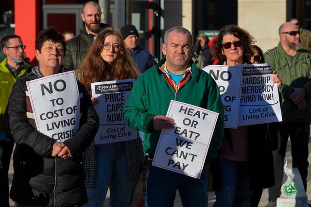 People carry placards at the Derry Against Fuel Poverty protest in Waterloo Square on Saturday afternoon last. Photo: George Sweeney.  DER2209GS – 061