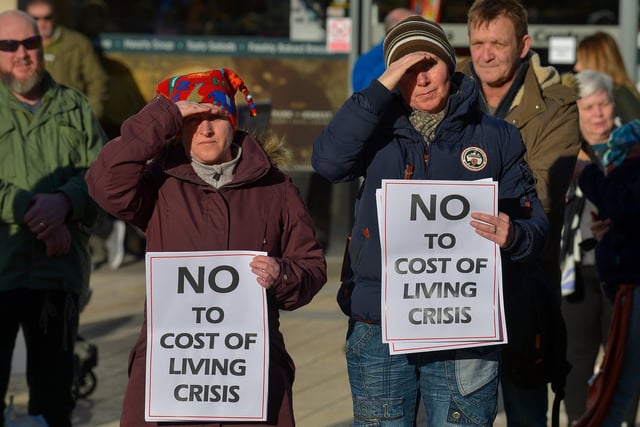 People carry placards at the Derry Against Fuel Poverty rally in Waterloo Square on Saturday afternoon last. Photo: George Sweeney.  DER2209GS – 062
