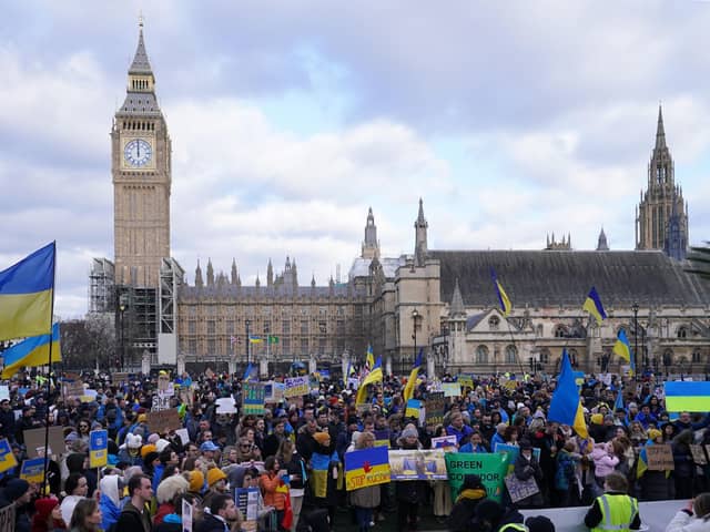 People take part in a demonstration in Parliament Square, London, to denounce the Russian invasion of Ukraine. Picture date: Sunday March 6, 2022: Ian West/PA Wire