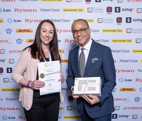 Laura Vogan pictured receiving her #SBS award from Dragon’s Den star Theo Paphitis