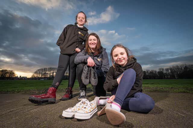 Hannah and Beth McConville, with Laura O’Hare, the Cancer Support Specialist for the Cancer Fund for Children, prepare to take part in the Youth Advisory Group’s ‘Mile in My Shoes’ walk at Antrim Castle Gardens on March 19.