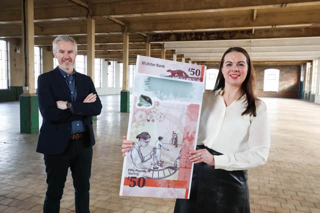 Terry Robb, Head of Personal Banking, Ulster Bank, and Sandra Wright, Senior HR Manager, reveal the designs for the bank’s new £50 note at a former linen mill in Portview Trade Centre, Belfast