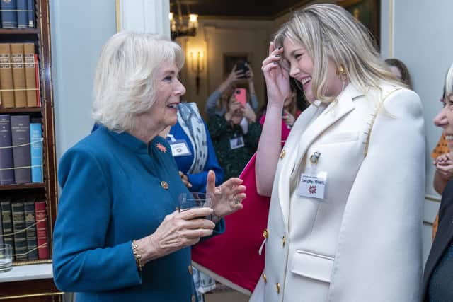 The Duchess of Cornwall (left) as President of WOW - Women of the World Festival, speaks to actress, filmmaker, and writer, Emerald Fennell, during a reception to mark International Women's Day at Clarence House, London. Picture date: Tuesday March 8, 2022.