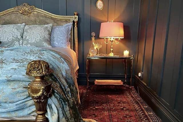“My bed frame is a Victorian reproduction of a Louis XIV-style bed. It cost 180 euro at Irish liquidators. 
The side brass and glass table is 1970s French Hollywood revival, bought from Re-Store on the Newtownards Road, East Belfast, for £20.  The lamp is a 1980s bought in Habitat for Humanity in Lisburn. The rug cost £60 from On The Square Emporium.”