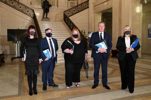 Ministers (left to right) Ministers Nichola Mallon, Robin Swann, Naomi Long, Conor Murphy and Michelle McIlveen as they head to the Northern Ireland Assembly chamber at Stormont before the delivery of the long-awaited public apology to the victims of historical institutional abuse. The public apology was recommended in the final report of the Historical Institutional Abuse Inquiry (HIAI), which was published more than five years ago. Issue date: Friday March 11, 2022.