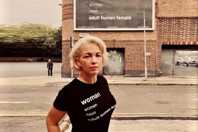 Feminist activist Posie Parker in 2018, protesting attempts to change the definition of ‘woman’; this billboard with the dictionary definition of the term was removed after transgender activists complained it was hateful