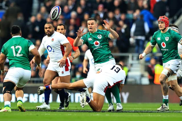LONDON, ENGLAND - MARCH 12:  Johnny Sexton of Ireland off loads the ball during the Guinness Six Nations Rugby match between England and Ireland at Twickenham Stadium on March 12, 2022 in London, England. (Photo by David Rogers/Getty Images)