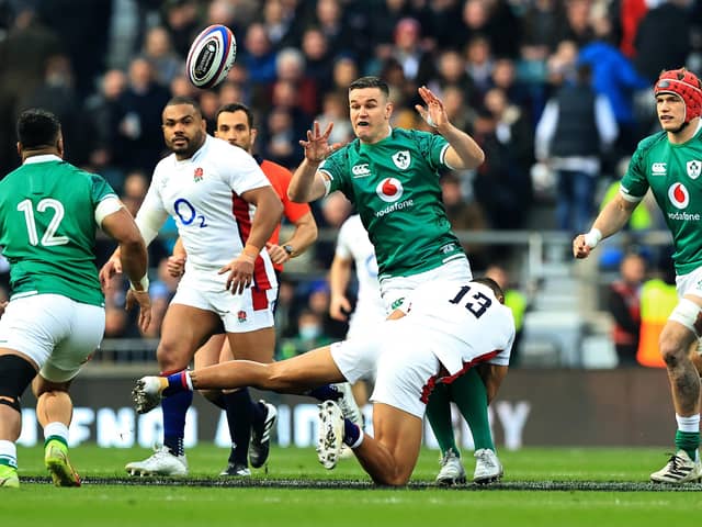 LONDON, ENGLAND - MARCH 12:  Johnny Sexton of Ireland off loads the ball during the Guinness Six Nations Rugby match between England and Ireland at Twickenham Stadium on March 12, 2022 in London, England. (Photo by David Rogers/Getty Images)