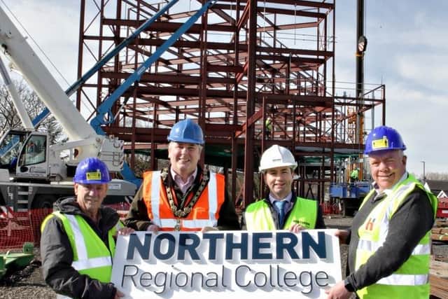 Northern Regional College principal and CE Mel Higgins welcomes Mayor Cllr Richard Holmes, Causeway Chamber president David Boyd and local resident Roy Barker on-site to view construction progress at the College's new Coleraine campus
