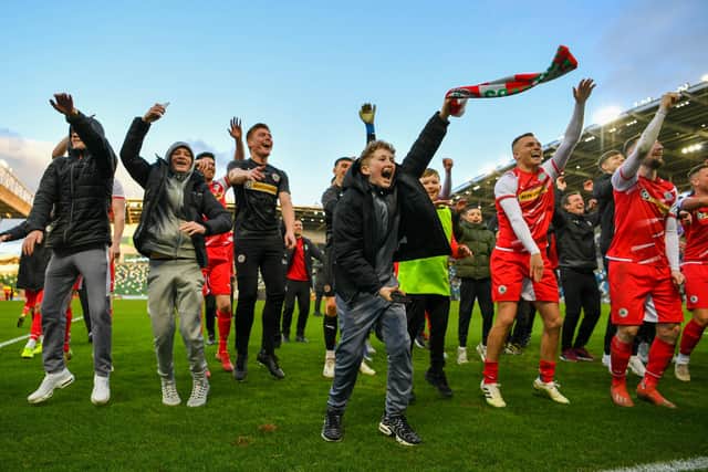 Celebrations by the Cliftonville camp on a landmark day for football in Northern Ireland. Pic by Pacemaker.