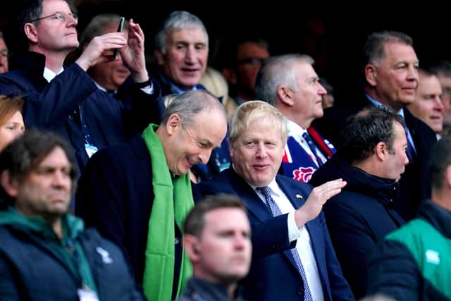 Prime Minister Boris Johnson (right) and Taoiseach Micheal Martin in the stands ahead of the Guinness Six Nations match at Twickenham Stadium, London.