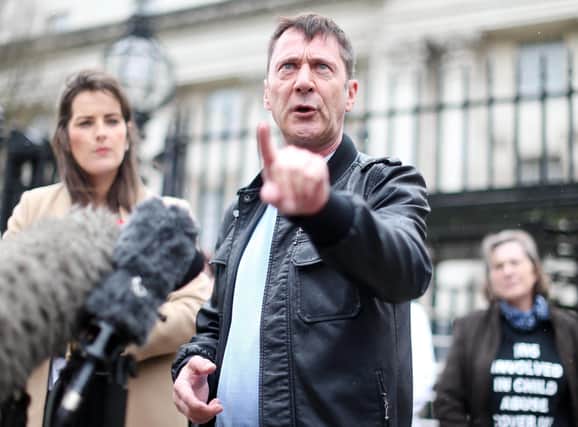 Richard Kerr talks to the press outside the High Court in Belfast after a previous hearing