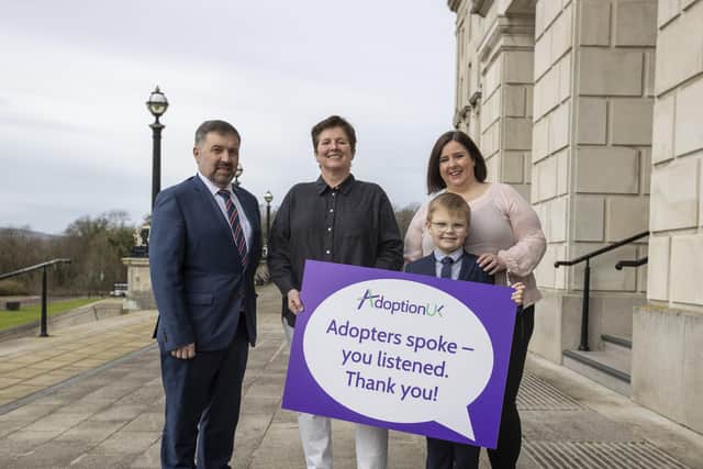 Health Minister Robin Swann, EJ Havlin, Director of Adoption UK, and Kathy Brownlee with her adopted son Mack Brownlee (aged 9) on the steps of Parliament Buildings at Stormont in Belfast. Picture: Liam McBurney/PA Wire