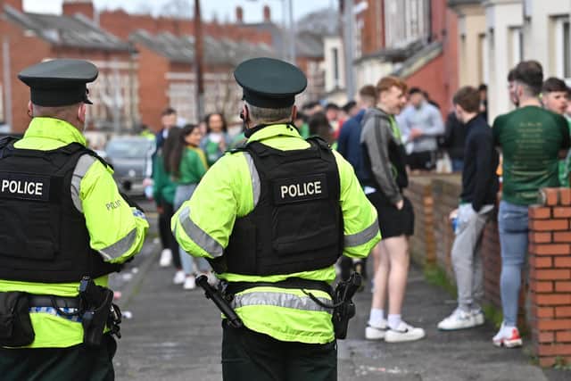 Police and community workers observe the Holylands area  in south Belfast, on St Patrick's Day on Thursday.
 
Photo: Colm Lenaghan/ Pacemaker