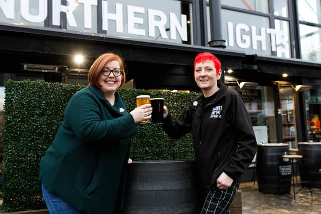Jennifer Noble of the Belfast Women’s Beer Collective and Sinead Cashman, manager of Northern Lights Bar try a few pints of the new chocolate, chili, chai stout called ‘Girls Just Wanna Mash Tun’