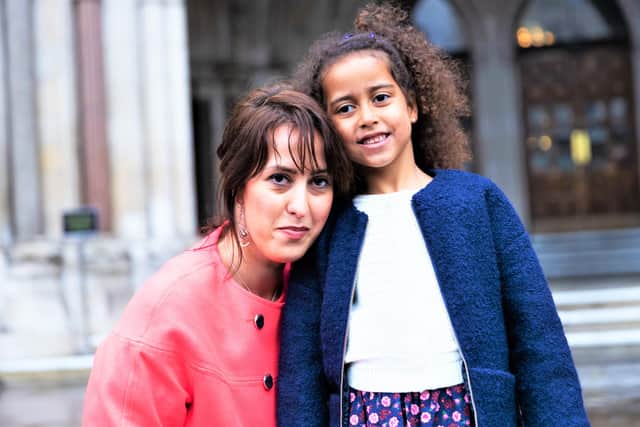 Alina Dulgheriu  with her daughter Sarah outside the High Court in London