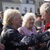 Prince Charles talks to Violet Massey and Annie King at CS Lewis Square