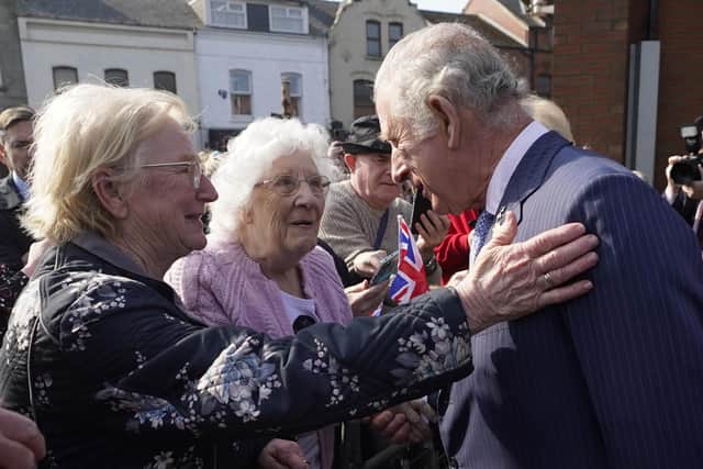 Prince Charles talks to Violet Massey and Annie King at CS Lewis Square