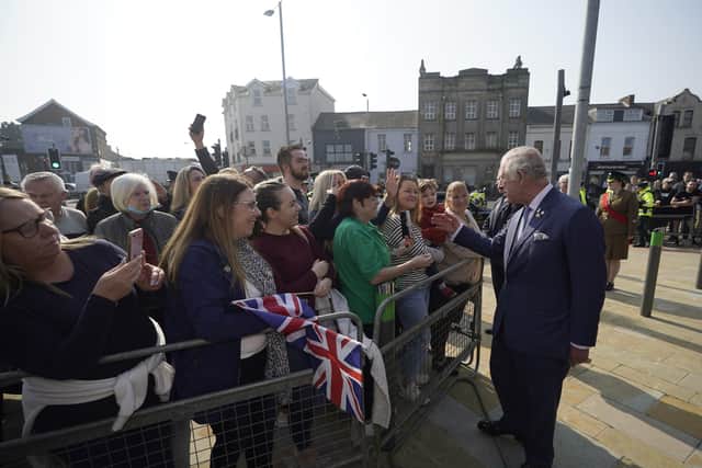 The Prince of Wales and Duchess of Cornwall talk to people gathered at CS Lewis Square.

Photo by Kelvin Boyes / Press Eye