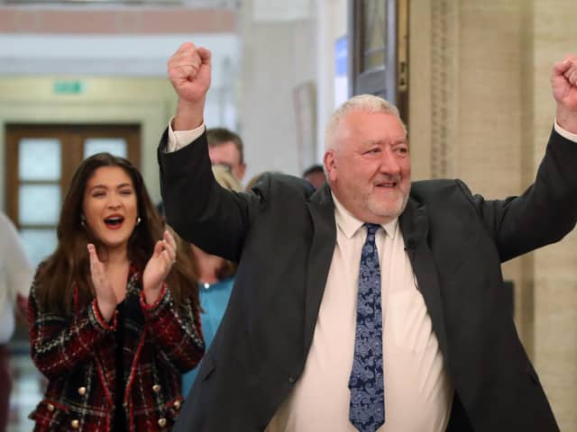 Pat Catney emerges from the chamber jubilant after his Period Poverty Bill passes.