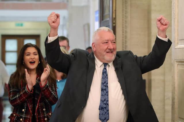 Pat Catney emerges from the chamber jubilant after his Period Poverty Bill passes.