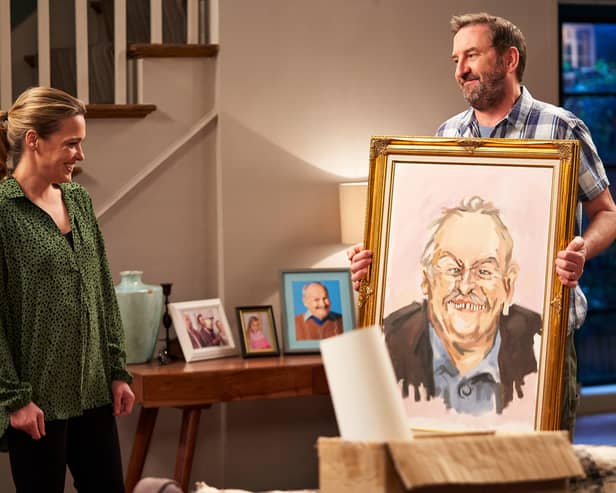 Lee and Lucy with the painting of Frank