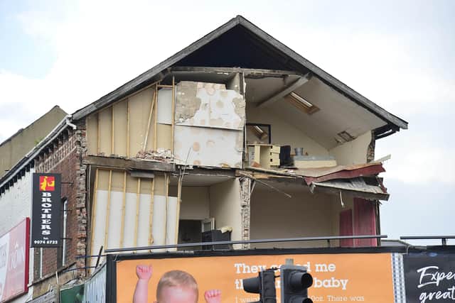 The gable wall of the building appears to have completely fallen away, exposing the insides of the building, on the Antrim Road in North Belfast.Picture By: Arthur Allison/Pacemaker Press.