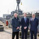 At HMS Caroline in Belfast are NMRN Chief of Staff and HMS Caroline Project Director Captain John Rees OBE; Economy Minister Gordon Lyons; and NMRN Director General Professor Dominic Tweddle