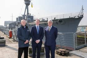 At HMS Caroline in Belfast are NMRN Chief of Staff and HMS Caroline Project Director Captain John Rees OBE; Economy Minister Gordon Lyons; and NMRN Director General Professor Dominic Tweddle