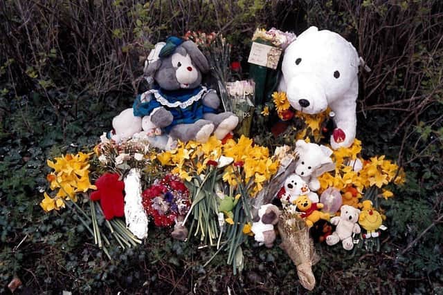 A shrine to Baby Carrie at the spot where she was found at the rear of Lough Moss leisure centre, Carryduff, on March 26, 2002.