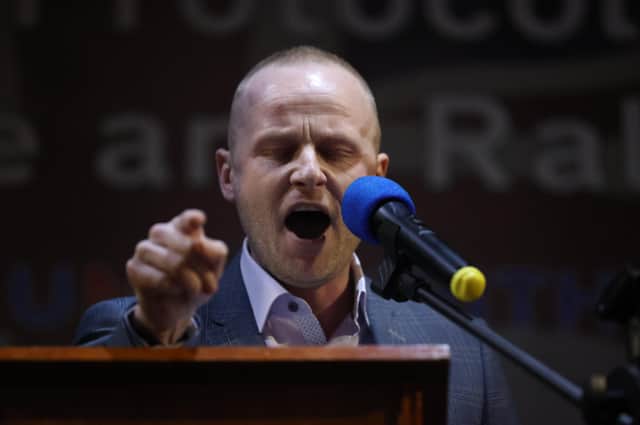 Loyalist blogger Jamie Bryson speaks during a anti Northern Ireland Protocol rally and parade, organised by North Antrim Amalgamated Orange Committee, in Ballymoney, Co Antrim. Picture date: Friday March 25, 2022
