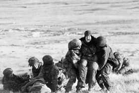 File photo dated 04/06/82 of British paratroopers carrying out emergency medical treatment on wounded comrades whilst under fire on Mount Longdon during the Falklands campaign. A series of lectures, memorials, exhibitions and other events will be launched in the coming days to mark the 40th anniversary of the end of the Falklands War. The aim is to commemorate the sacrifices made in 1982 and to celebrate the progress made in the islands in the South Atlantic over the past 40 years. Issue date: Sunday March 27, 2022.