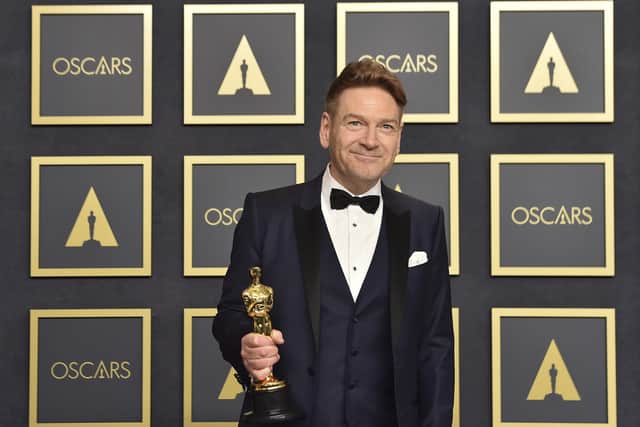 Kenneth Branagh, winner of the award for best original screenplay for "Belfast," poses in the press room at the Oscars.