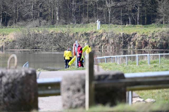 A large police presence  pictured at a scene at Woodburn Dams in Carrickfergus on Monday. Picture: Pacemaker