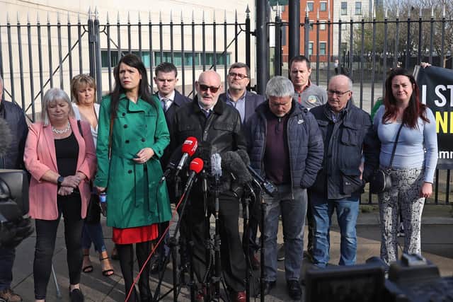 Grainne Teggart from Amnesty International (centre left), Sean McAnespie, Aidan's brother (centre) and Aidan's cousin Brian Gormley (centre right) speaking to the media outside Laganside Courts in Belfast.