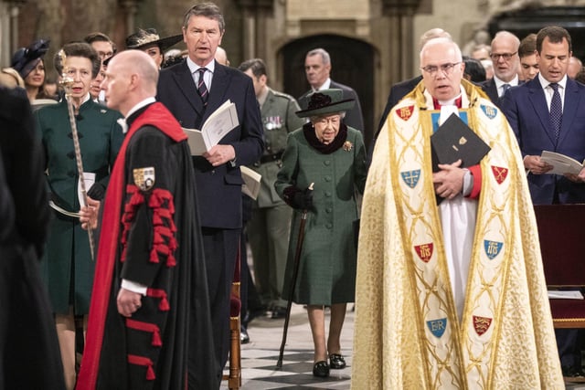 Queen Elizabeth II and the Duke of York (hidden) arrive at a Service of Thanksgiving