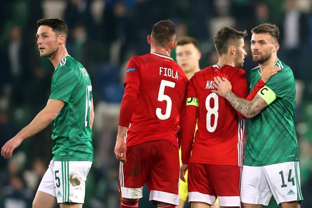 Northern Ireland's Stuart Dallas (right) and Hungary's Adam Nagy shake hands after the final whistle during the international friendly match at Windsor Park, Belfast.