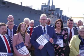 UUP leader Doug Beattie with party NI Assembly candidates beside battleship HMS Caroline in Belfast on Thursday. Photo: Colm Lenaghan/Pacemaker