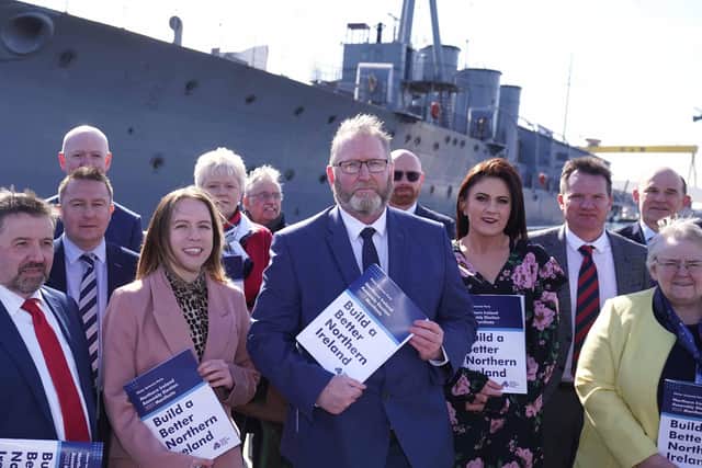 UUP leader Doug Beattie with party NI Assembly candidates beside battleship HMS Caroline in Belfast on Thursday. Photo: Colm Lenaghan/Pacemaker