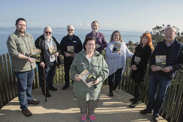 Nic Wright, Museums Engagement Officer at Causeway Coast and Glens Borough Council (left), pictured at Portaneevy Viewpoint outside Ballintoy with community volunteers who participated in the ‘Moyle Migrations’ project